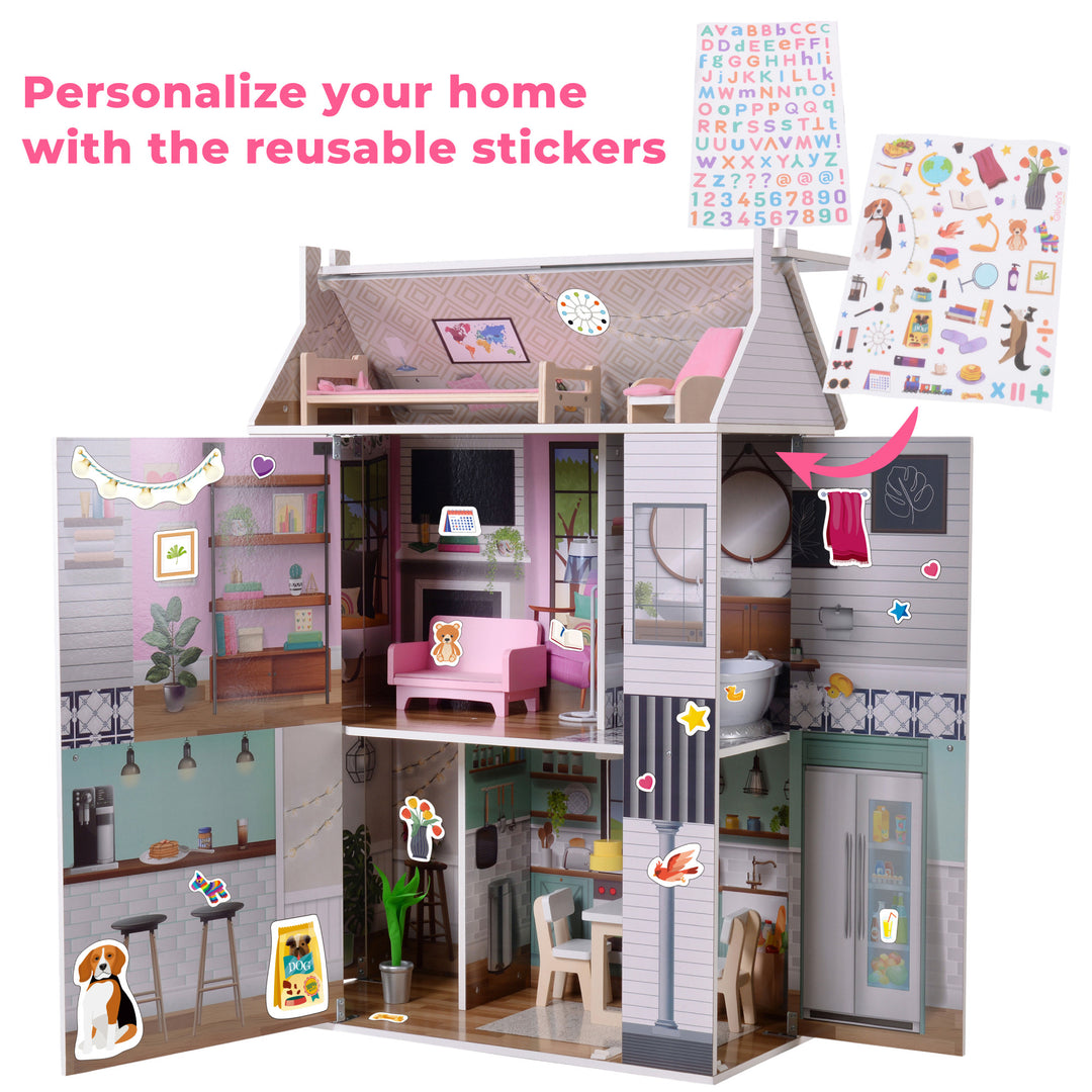 A view of the open dollhouse with stickers placed throughout the house and the caption "Personalize your home with the reusable stickers"