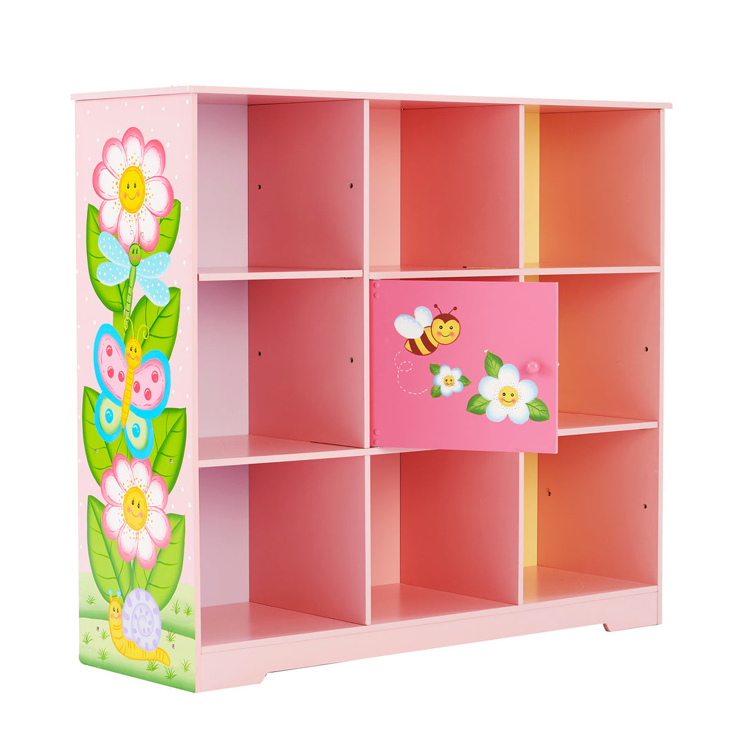 A durable Fantasy Fields Kids Painted Wooden Magic Garden Adjustable Cube Bookshelf, Pink with flowers and butterflies painted on it, designed as an ample storage kids' bookshelf.