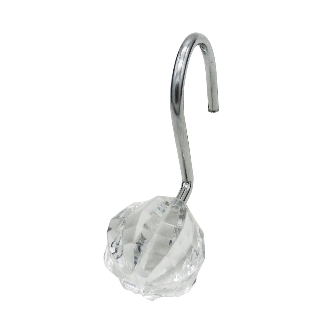 A chrome shower hook with a crystal accent