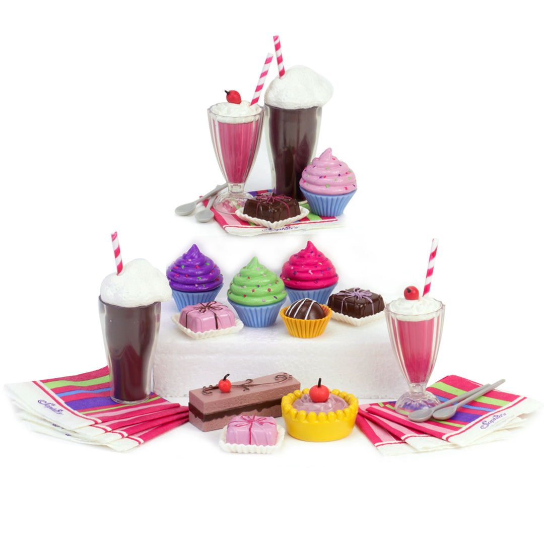 The pieces displayed in tiers, including: 4 cupcakes, 2 root beer floats, 2 cherry milkshakes, 4 spoons, 8 napkins, 6 baked treats