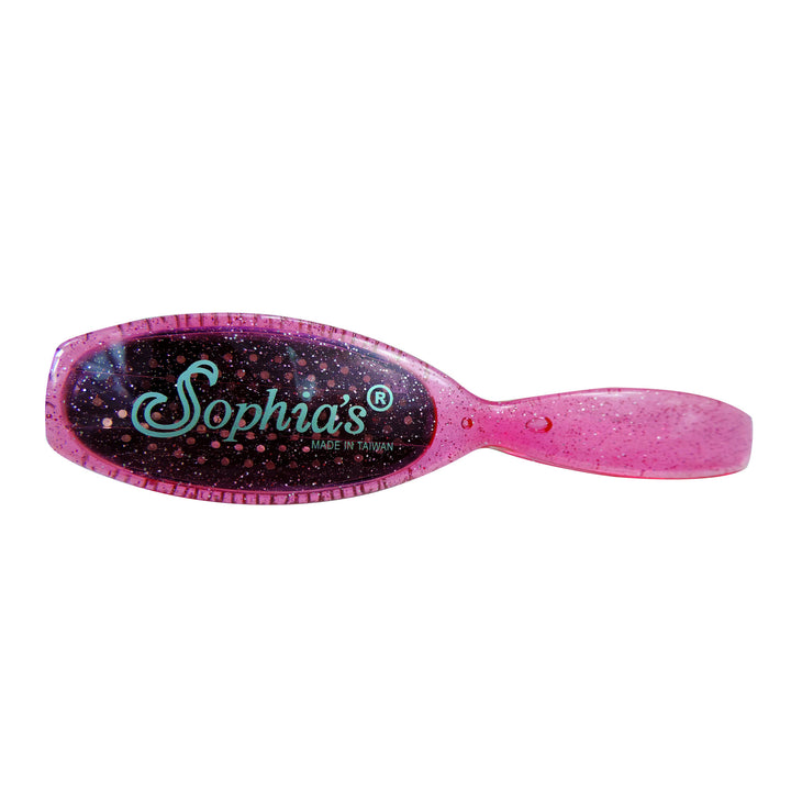 A pink Sophia’s Wig Hairbrush Accessory with the word sophias on it.