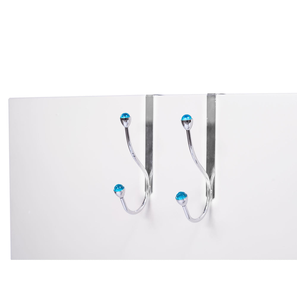 A pair of over the door hangers with blue acrylic accents on the top of a white door