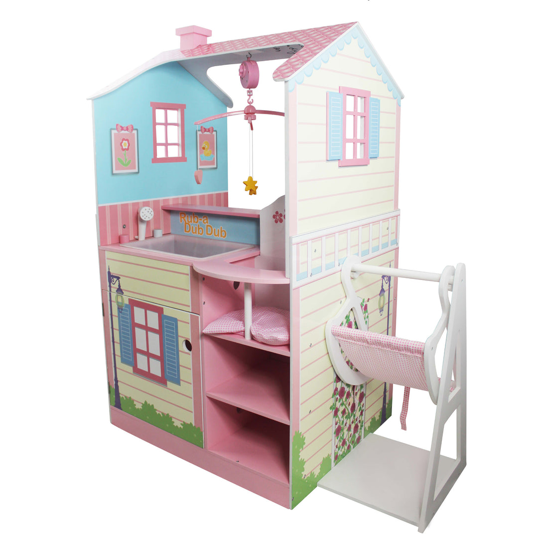 A dollhouse nursery with a crib and Olivia's Little World Baby Doll Changing Station Dollhouse with Storage, Multicolor.