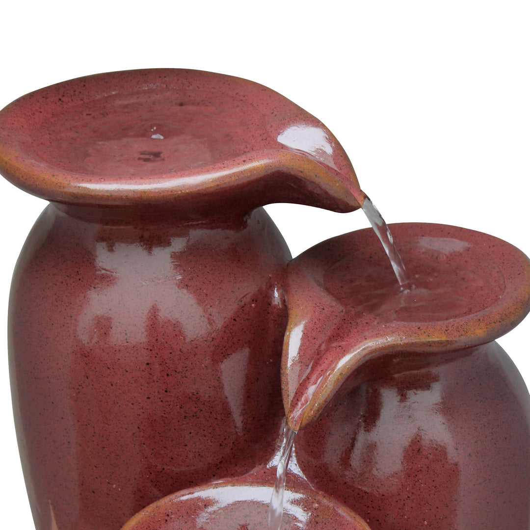 A close-up of the top of the jars, with speckled accents in the red finish