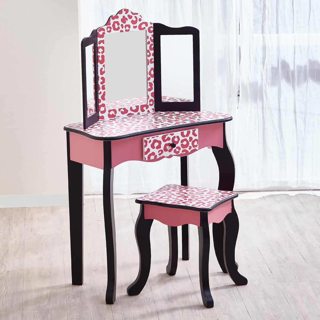 A Fantasy Fields Gisele Leopard Print Vanity Playset with a stool.