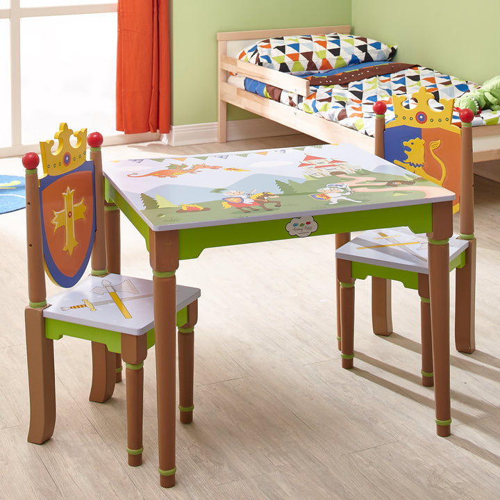 A Fantasy Fields Kids Painted Wooden Knights and Dragons table and chairs in a child's room.