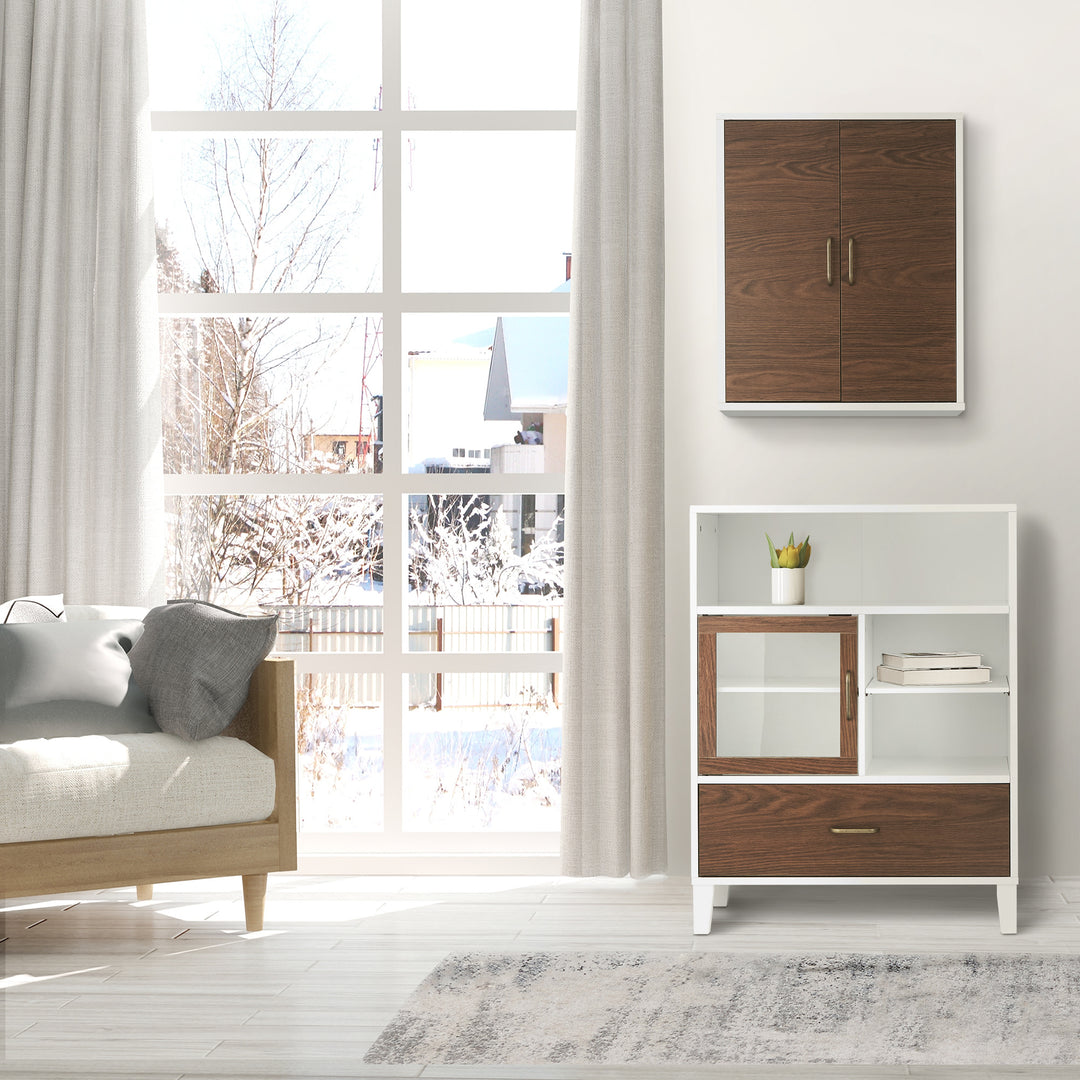 A Tyler floor cabinet in white and walnut in a living room underneath a coordinating wall cabinet