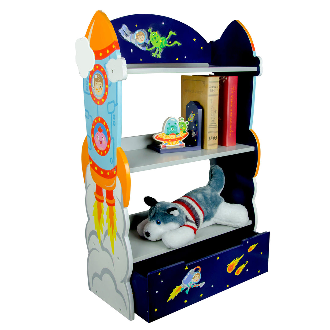 A Fantasy Fields Kids Wooden Outer Space Bookshelf with Drawer, Blue with a stuffed wolf and books on the shelves..