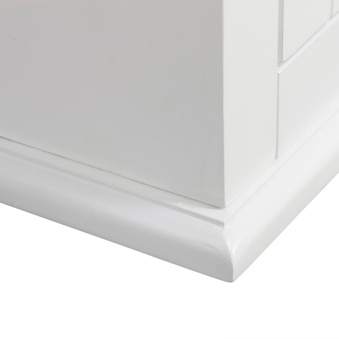 A close-up of the bottom of the Teamson Home White St. James Removable Wall Cabinet