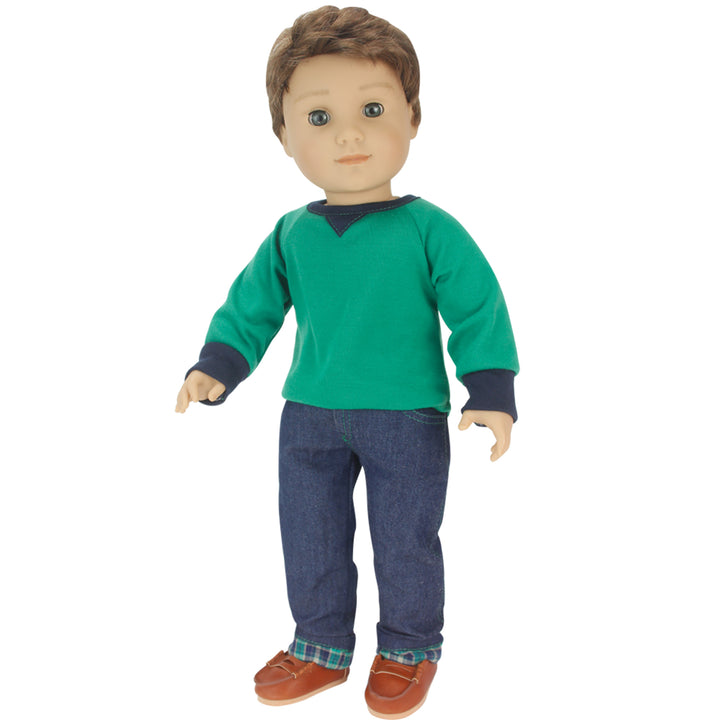 An 18" boy doll wearing a green shirt, jeans, and Penny Loafers.