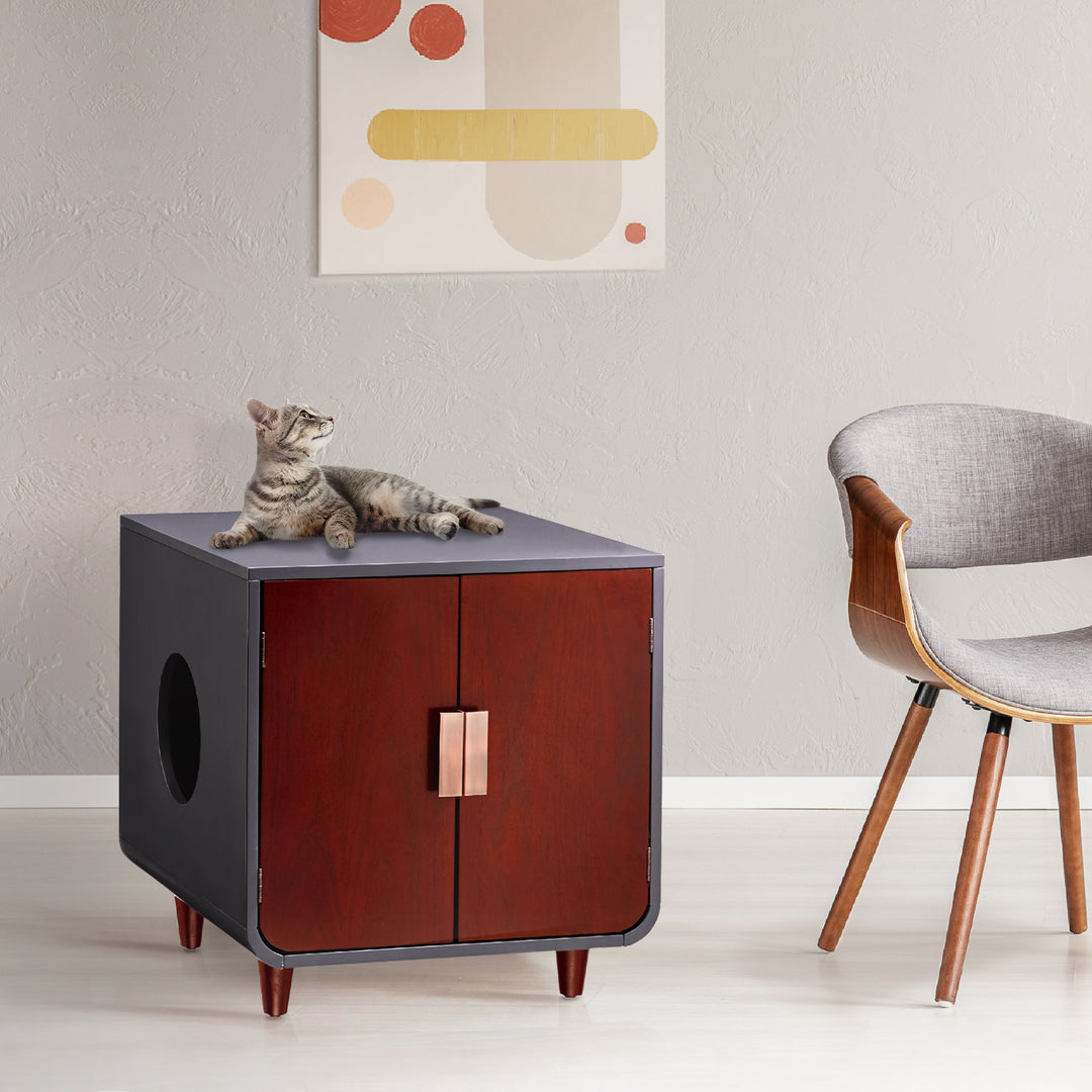 Teamson Pets Small Dyad Wooden Cat Litter Box Enclosure and Side Table with a cat laying on top looking up.