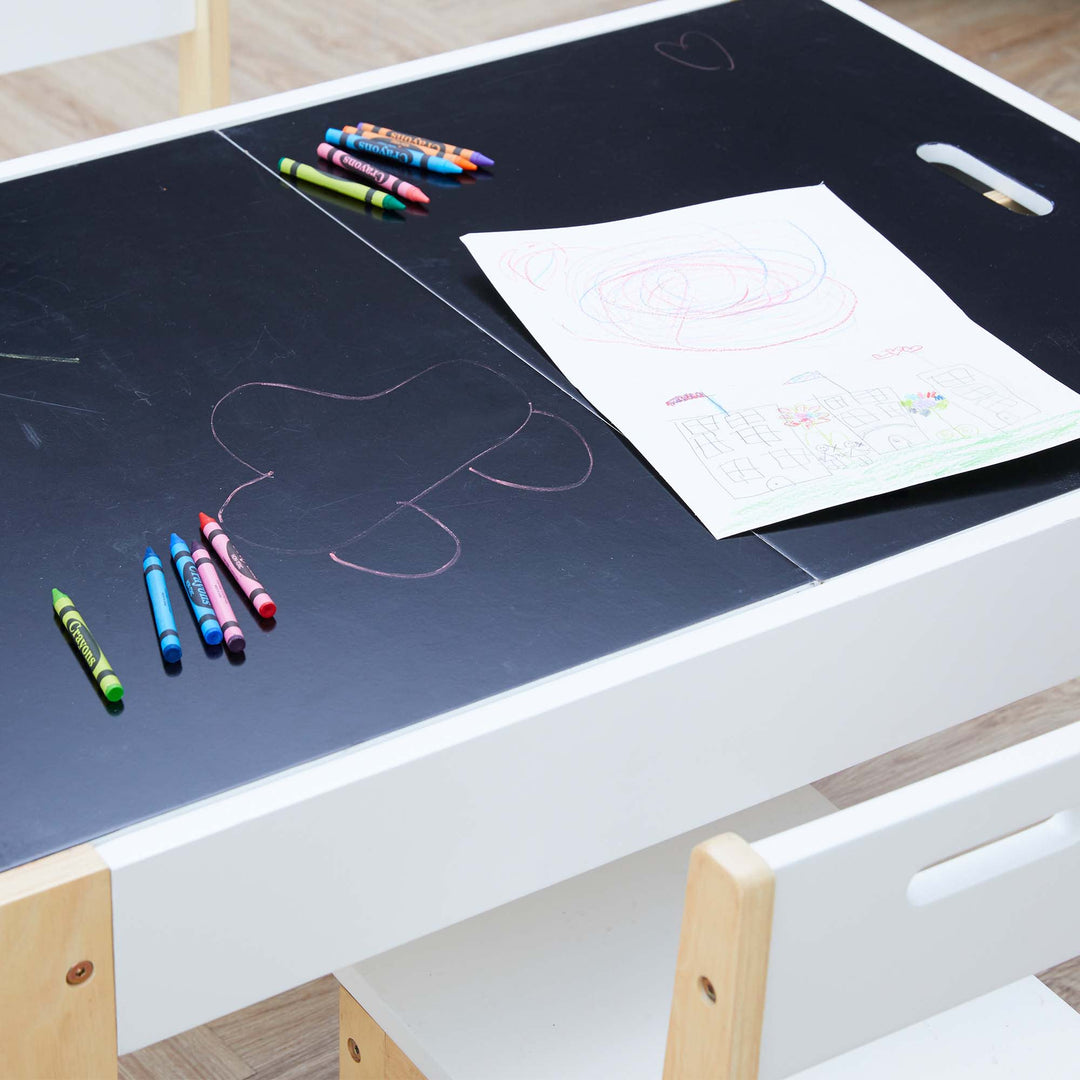 A close-up of the chalkboard surface on a child-sized table.
