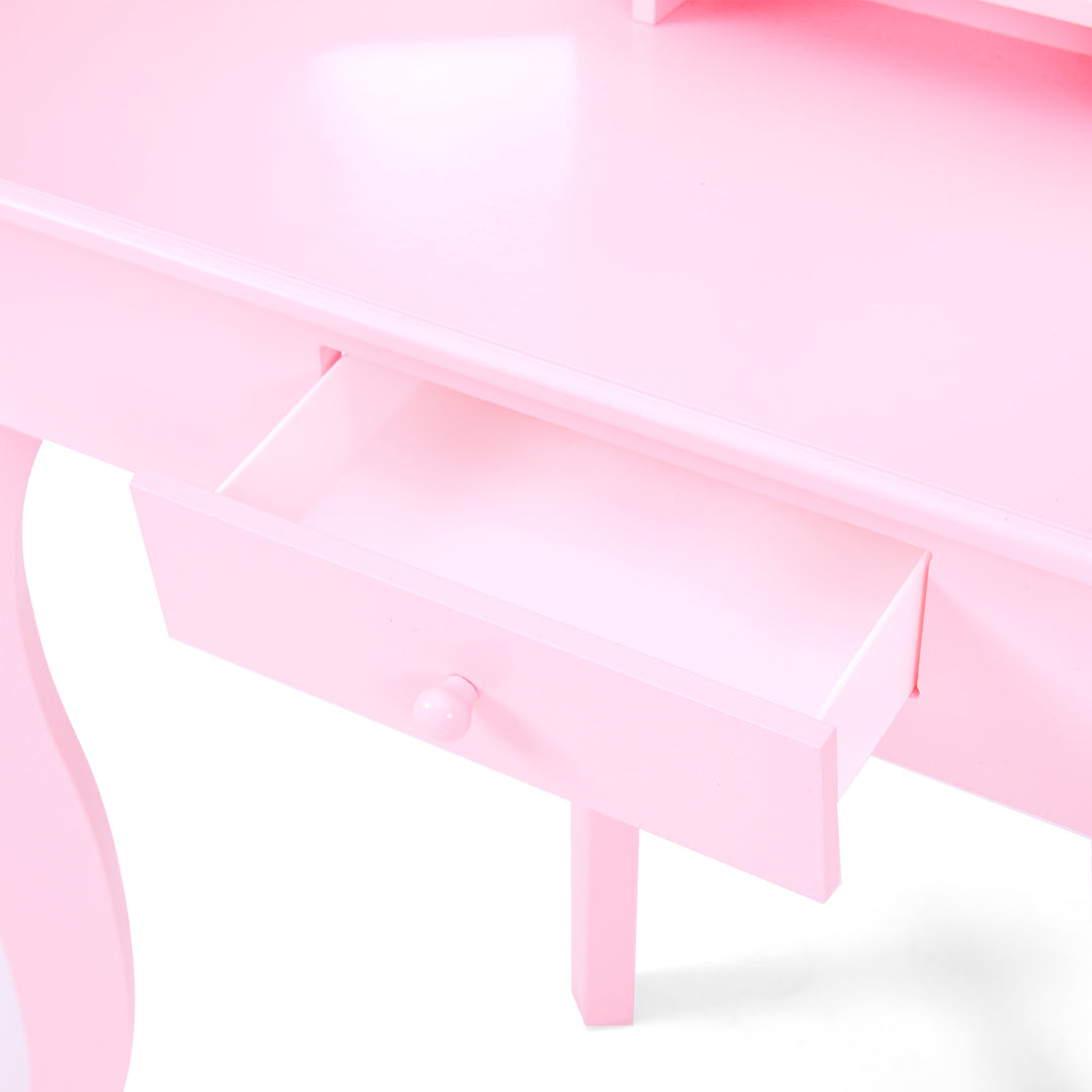 a close-up of the interior of a pink storage drawer on a pink vanity table
