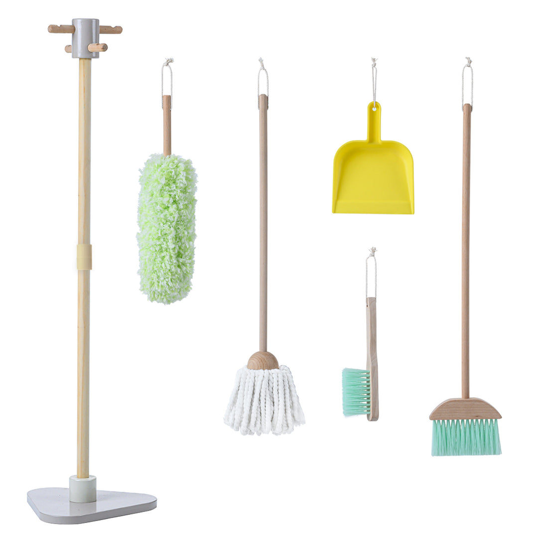 Assortment of Teamson Kids 6 Piece Little Helper Cleaning Set including a mop, duster, dustpan, and brushes with wooden handles and a stand to hold all the accessories on a white background.