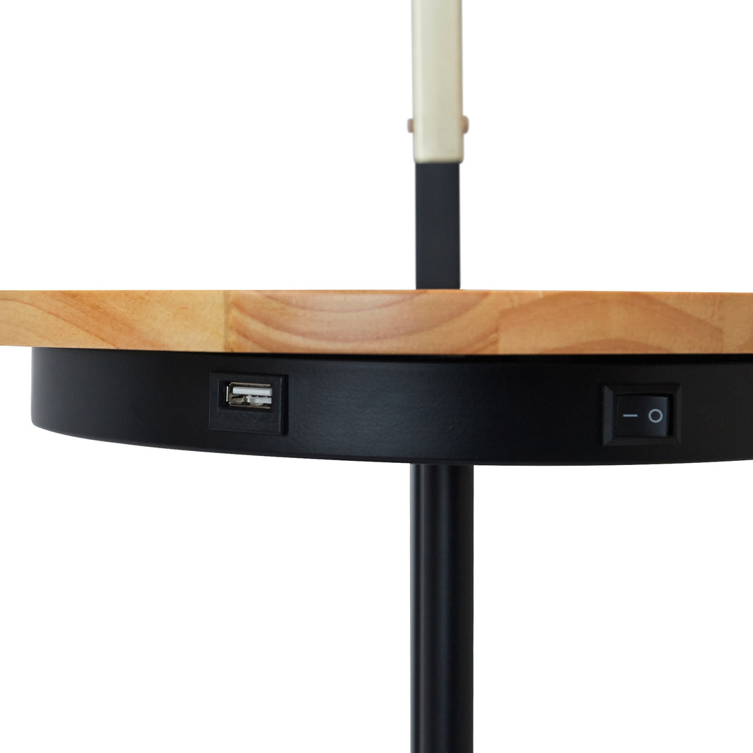 Close-up of the USB port and on/off switch below the tabletop of the Teamson Home Danna Floor Lamp with Marble Base and Built-In Table, Black