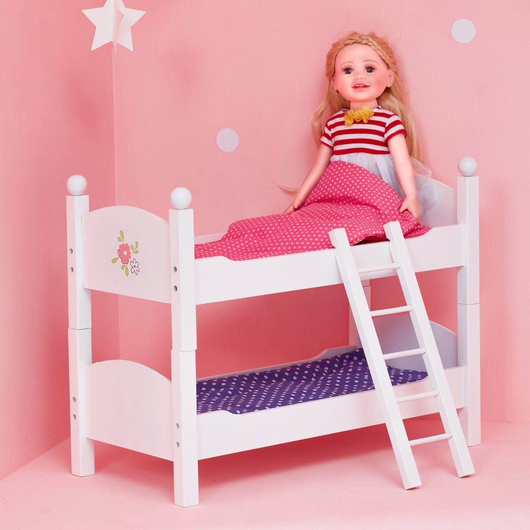 A Olivia's Little World Polka Dots Princess 18" Doll Bunk Bed, Gray is sitting on a doll bunk bed.