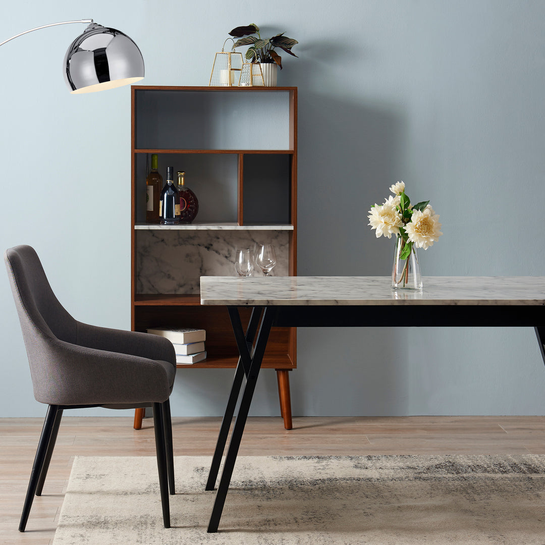  Teamson Home Ashton Dining Table with Black Wood Base and Faux Marble Tabletop with a gray dining chair, shelving unit, and chrome arc lamp
