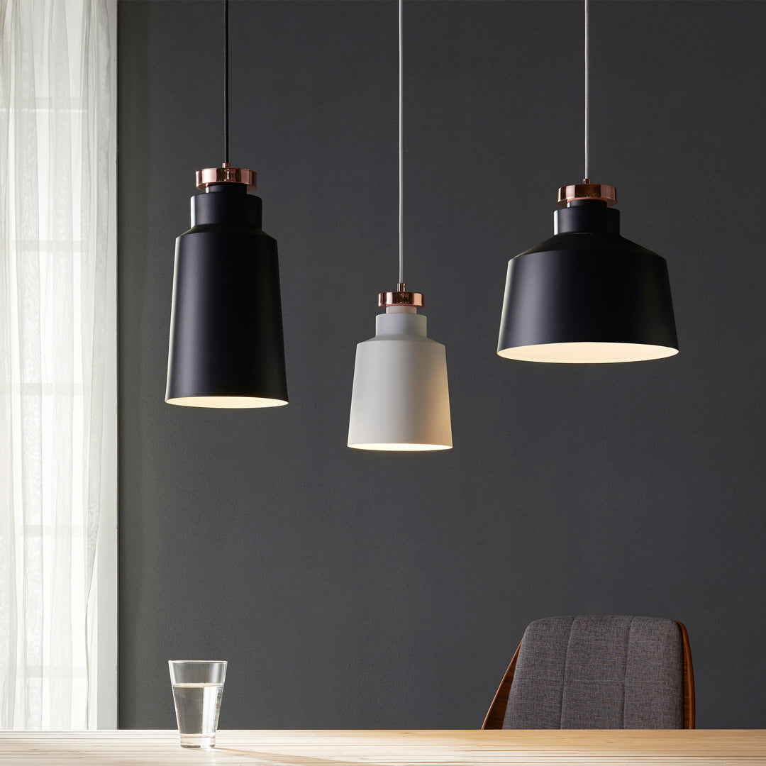 Three different pendant lights over a tabletop