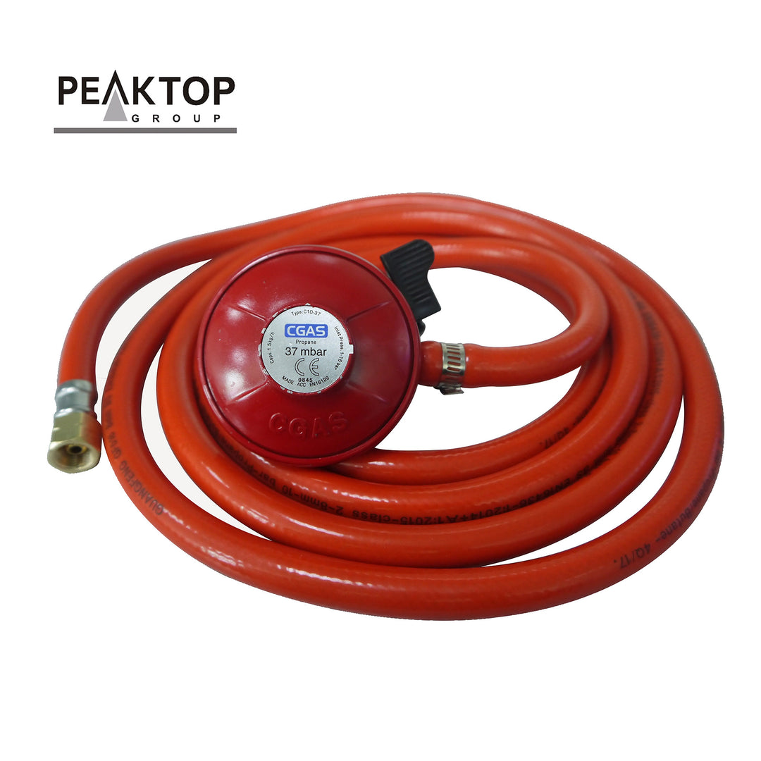An orange connection hose for the propane tank to the fire pit with a regulator, included.