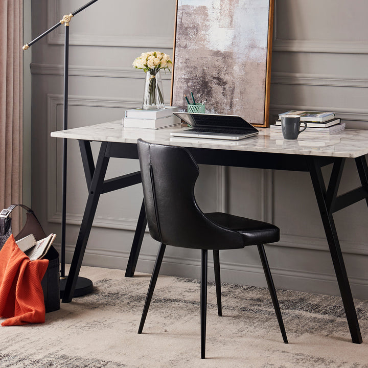 A desk with a Teamson Home Finley Dining Chair with Faux Black Leather  and a lamp.