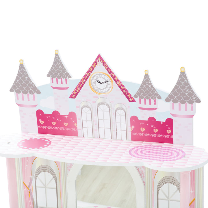 A close up of the top of the vanity that is shaped like a ballroom for dolls in pink and white and gray.