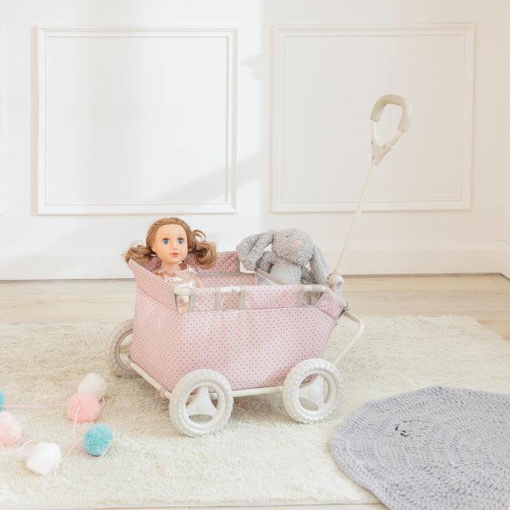 A Princess doll in Olivia's Little World Polka Dots Princess Baby Doll Wagon, Pink.