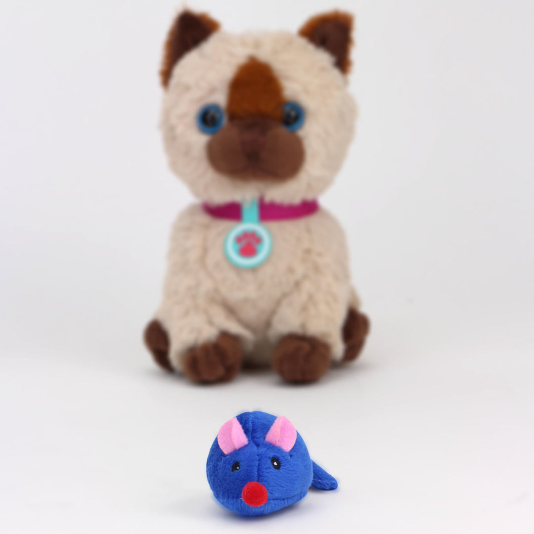 A siamese kitten sized for an 18" doll behind a toy blue mouse.