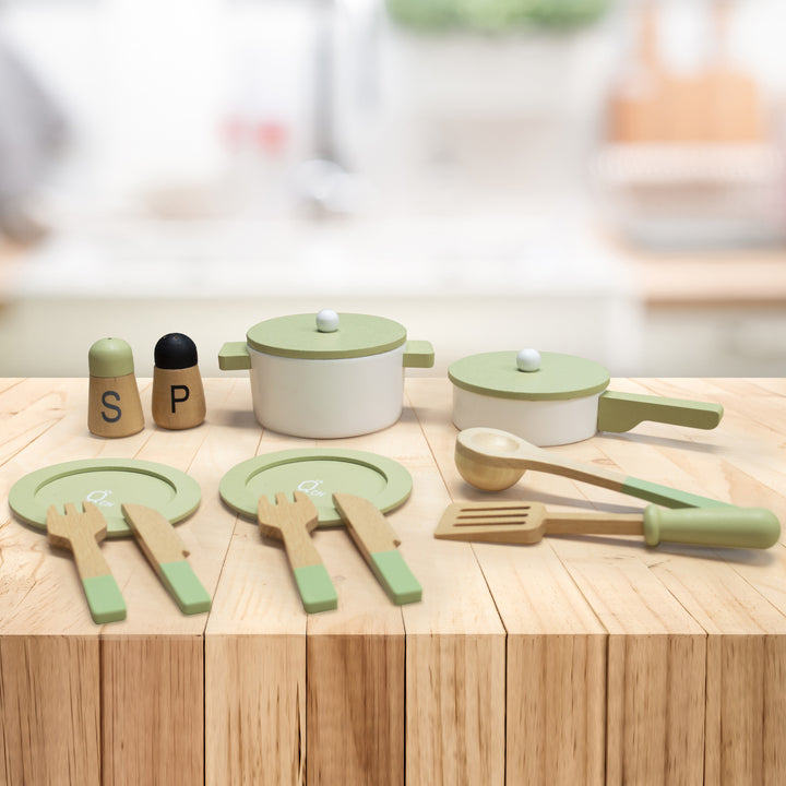 A set of Teamson Kids Little Chef Frankfurt Wooden Cookware Play Kitchen Accessories, Green displayed on a wooden countertop.