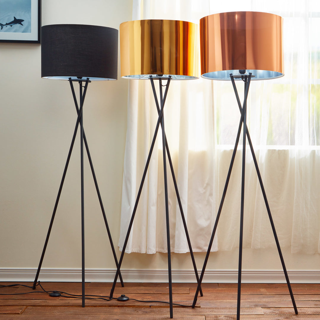A trio of Teamson Home Cara 62" Modern Tripod Floor Lamps with Metal Drum Shades - Black Shade, Gold Shade, and Rose Gold Shade