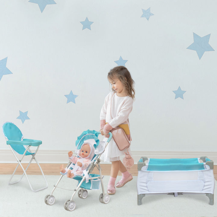 A little girl pushing a baby doll in a blue and white stroller, next to a matching high chair and folding crib.