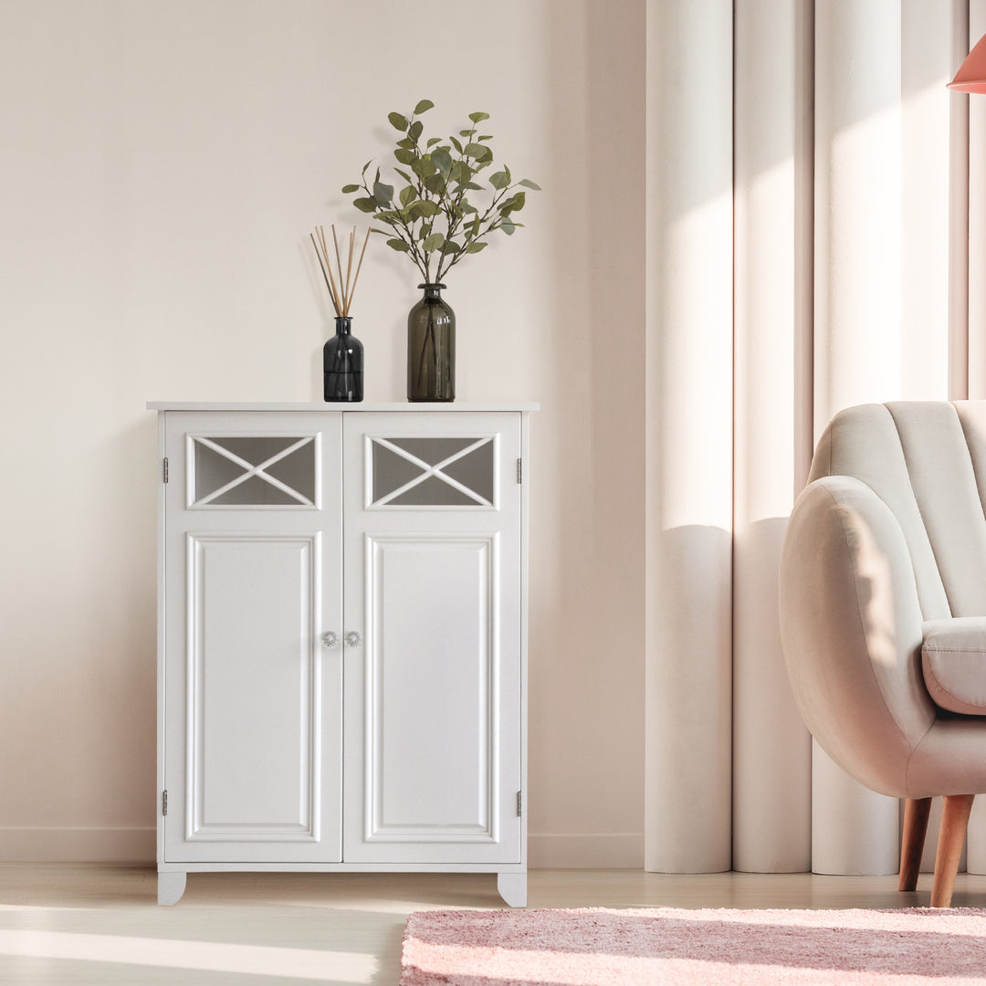 The Teamson Home Dawson Free Standing Floor Storage Cabinet with Adjustable Shelves in a room with a pink chair.
