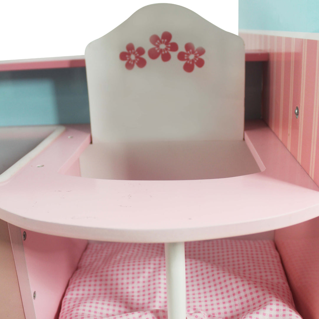 A close-up of the white with pink high chair  floral accents and the pink gingham seat cushion.