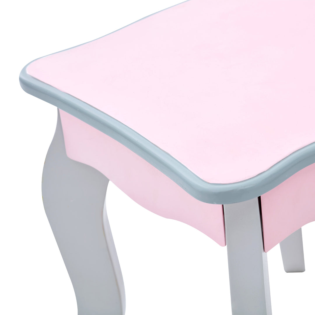 A close up of the rounded corners on the matching pink and gray stool for the vanity set.