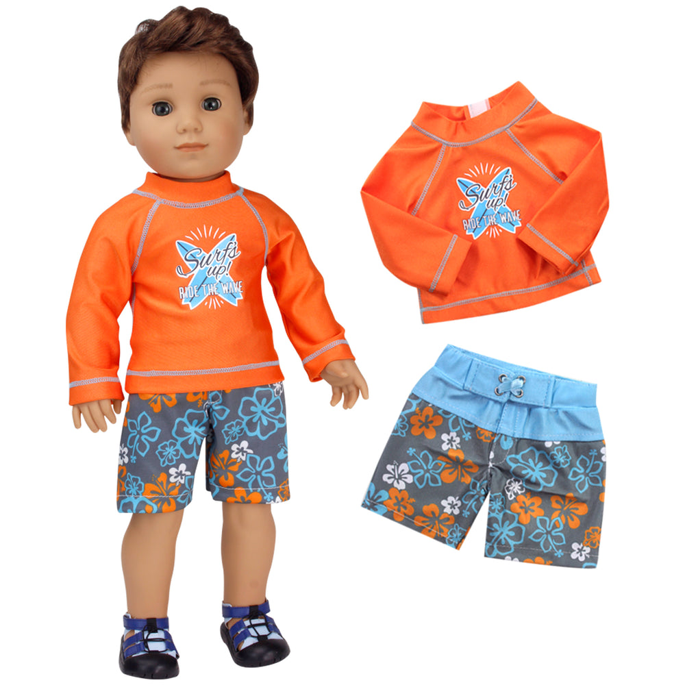 A brunette 18" boy doll with brown eyes wearing blue and gray floral swim shorts and an orange rash guard.