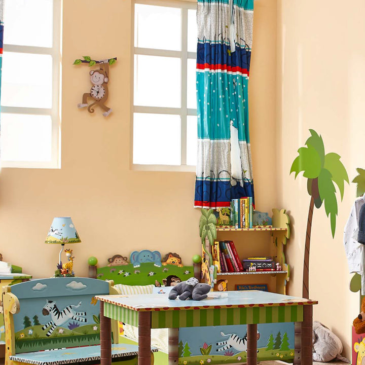 A child's room with a jungle theme, featuring a Fantasy Fields Kids Wooden Sunny Safari Monkey Wall Clock to help kids tell time.