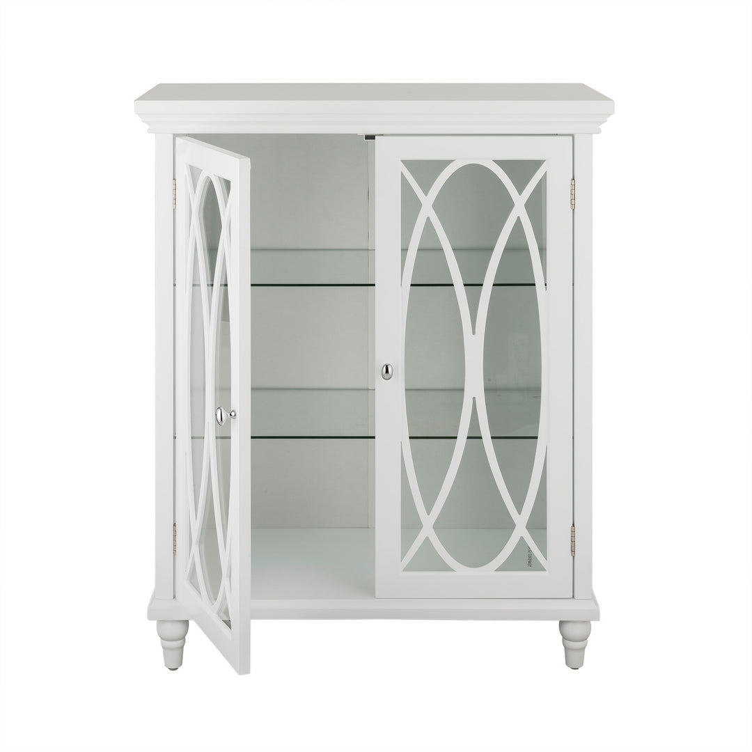 White Teamson Home Florence Floor Cabinet with a door open revealing the glass shelves inside