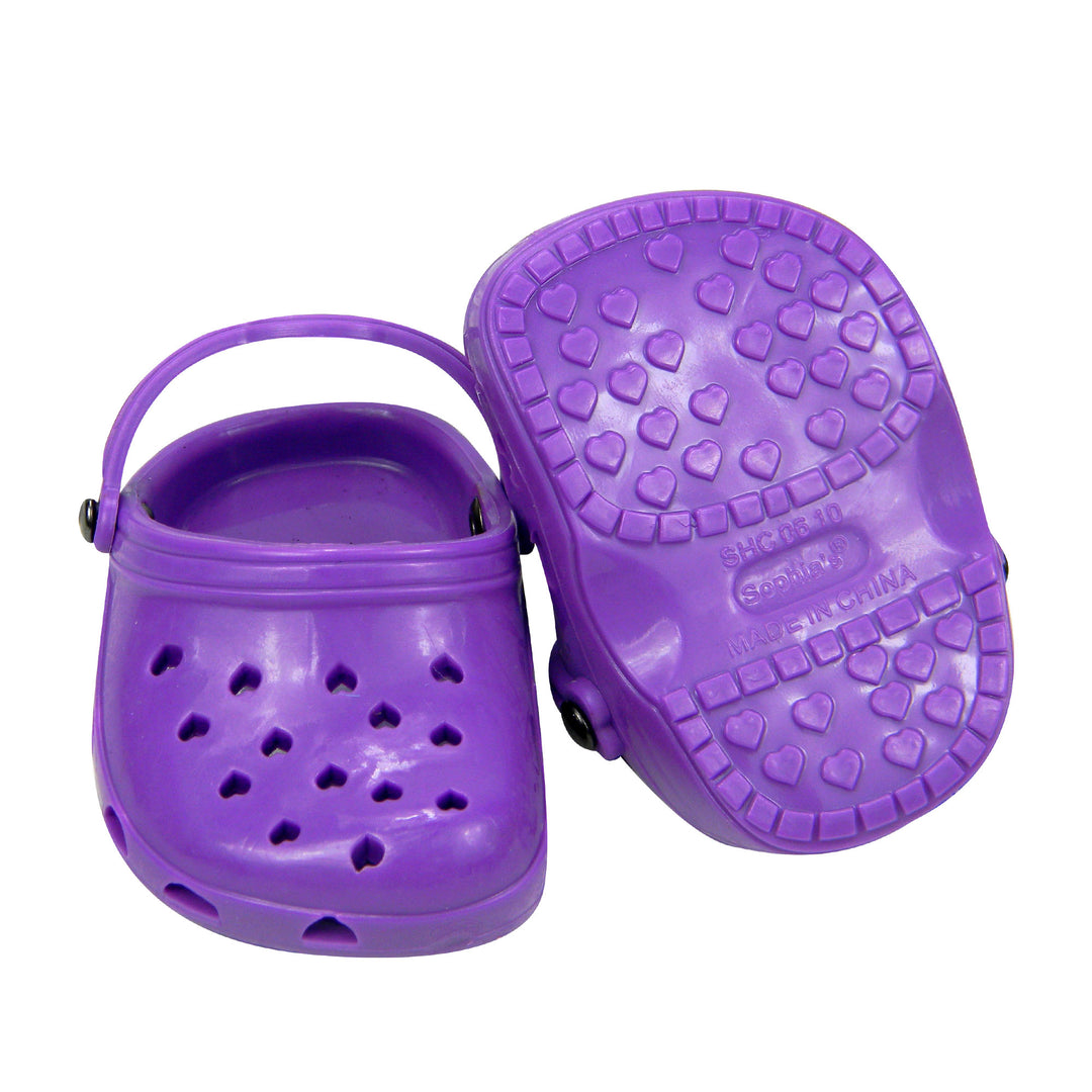 A pair of purple garden clogs for 18 inch dolls on a white background.