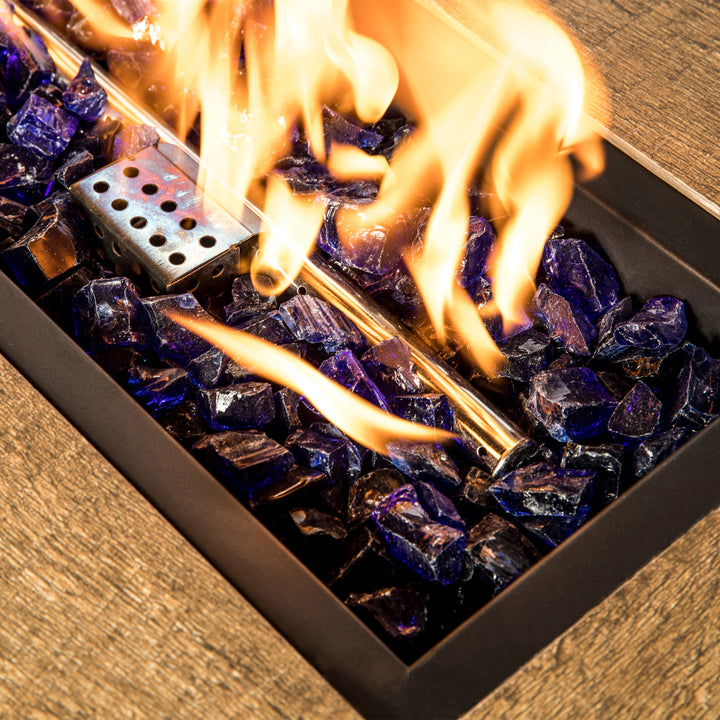 Teamson Home 1/2 Inch Reflective Blue Fire Glass in a gas fire pit