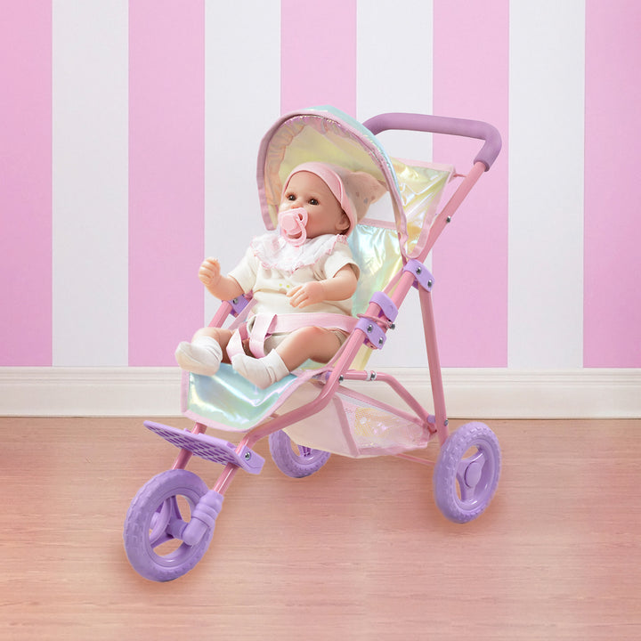 A baby doll in a iridescent baby doll jogging stroller.