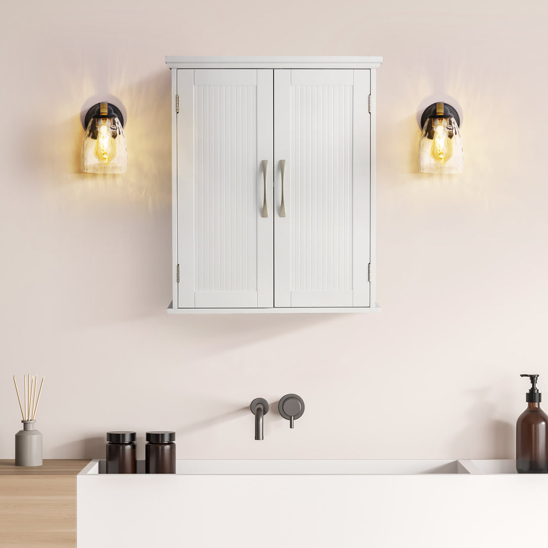 A minimalist bathroom interior with a Teamson Home Newport Contemporary Wooden Removable Cabinet, White made from durable engineered wood and twin vintage-style wall sconces, featuring adjustable storage space.