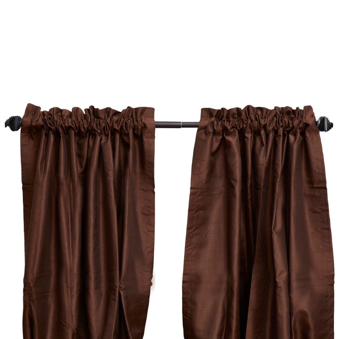 A pair of brown curtains hung on a Sunset Window Curtain Rod Abstract Finial, Black