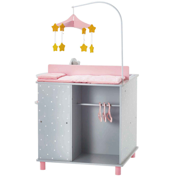 A baby doll changing station in pink and gray with white polka dots with a closet, mobile and changing table.