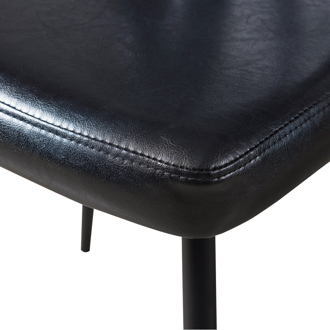A close up of a Teamson Home Finley Dining Chair with Faux Black Leather 