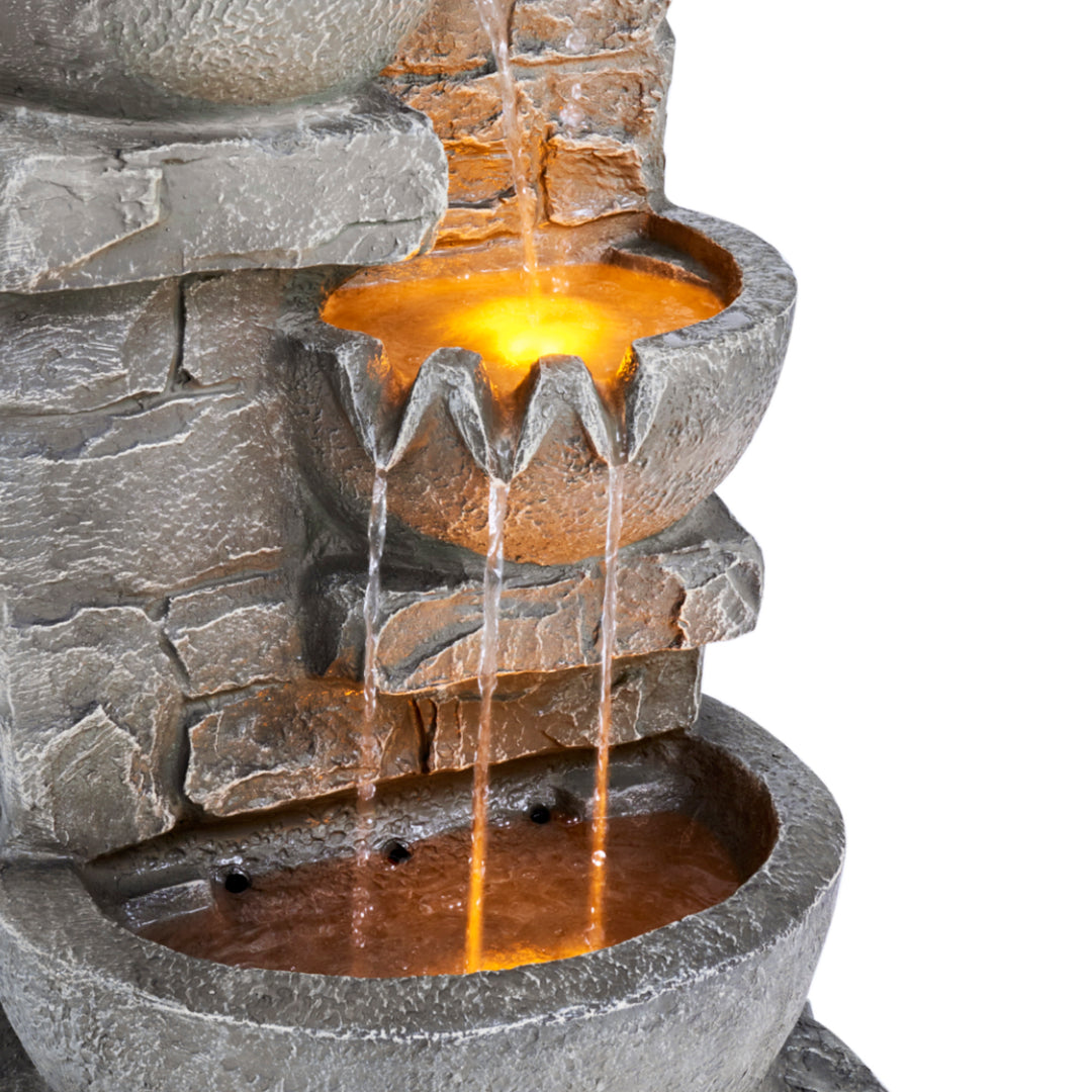A view of the bottom two tiers of the Teamson Home Outdoor Cascading Bowls & Stacked Stone  water fountain, gray