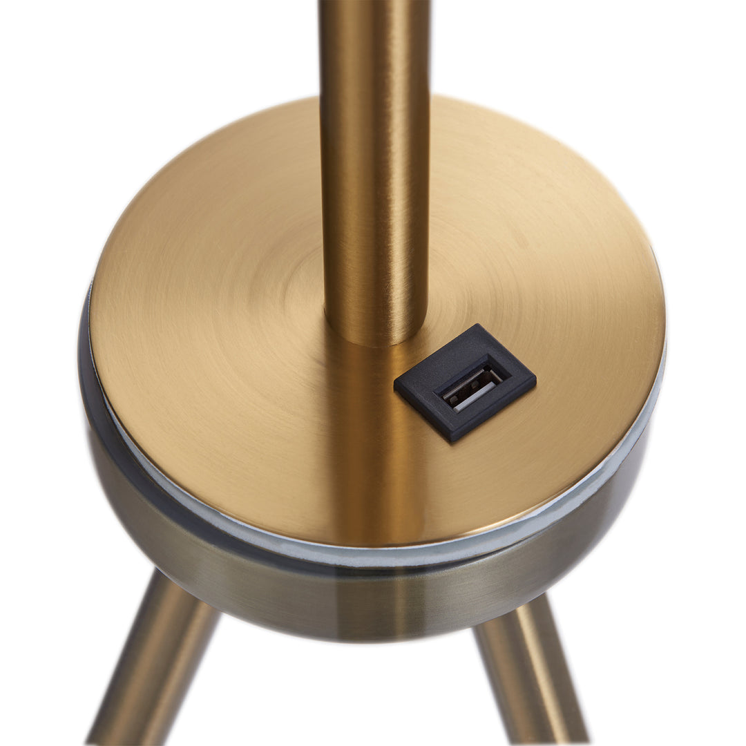 Close-up view of a USB port on the Teamson Home Myra Floor Lamp with Table, Gold/White Shade
