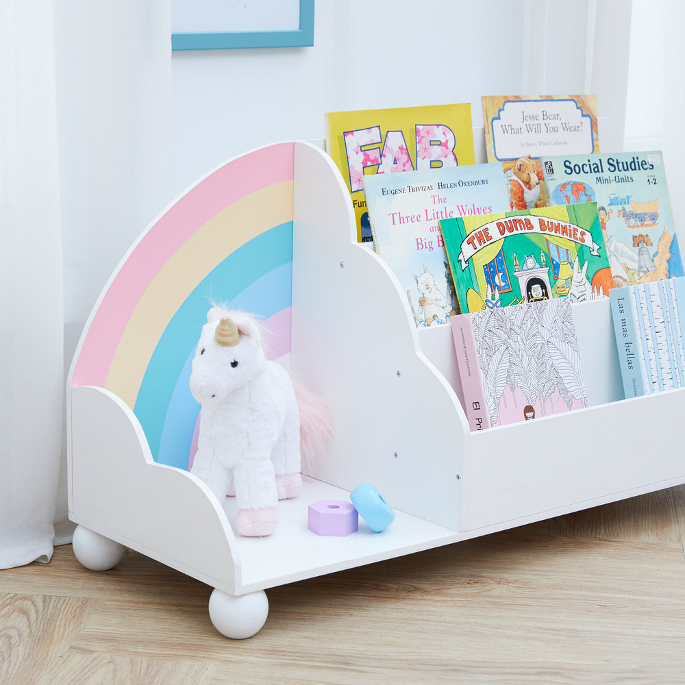 Books displayed in the Fantasy Fields  Rainbow Wooden Display Bookcase, White, with a unicorn next the rainbow.