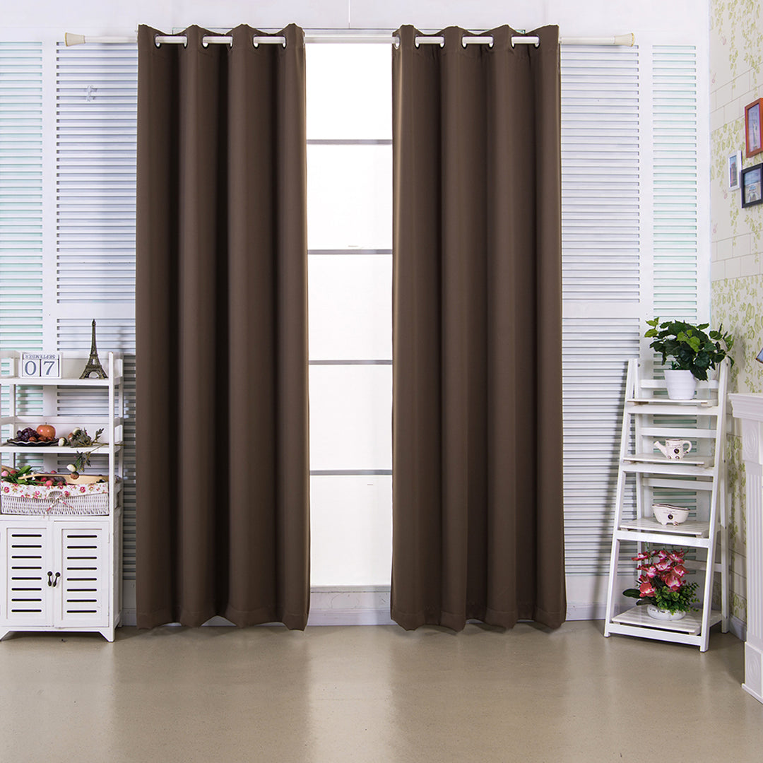 Brown Teamson Home 96" Edessa Premium Solid Insulated Thermal Blackout Window Curtain Panels with Grommets hanging in a well-lit room with white blinds and decorative shelves on both sides.