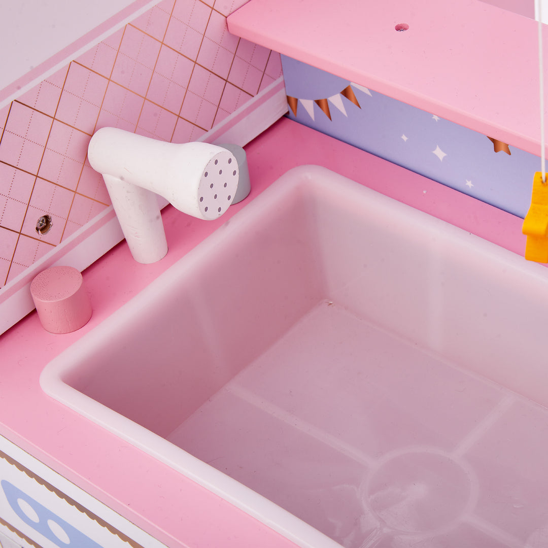 Close-up of the pink sink bathtub on the baby doll changing station.