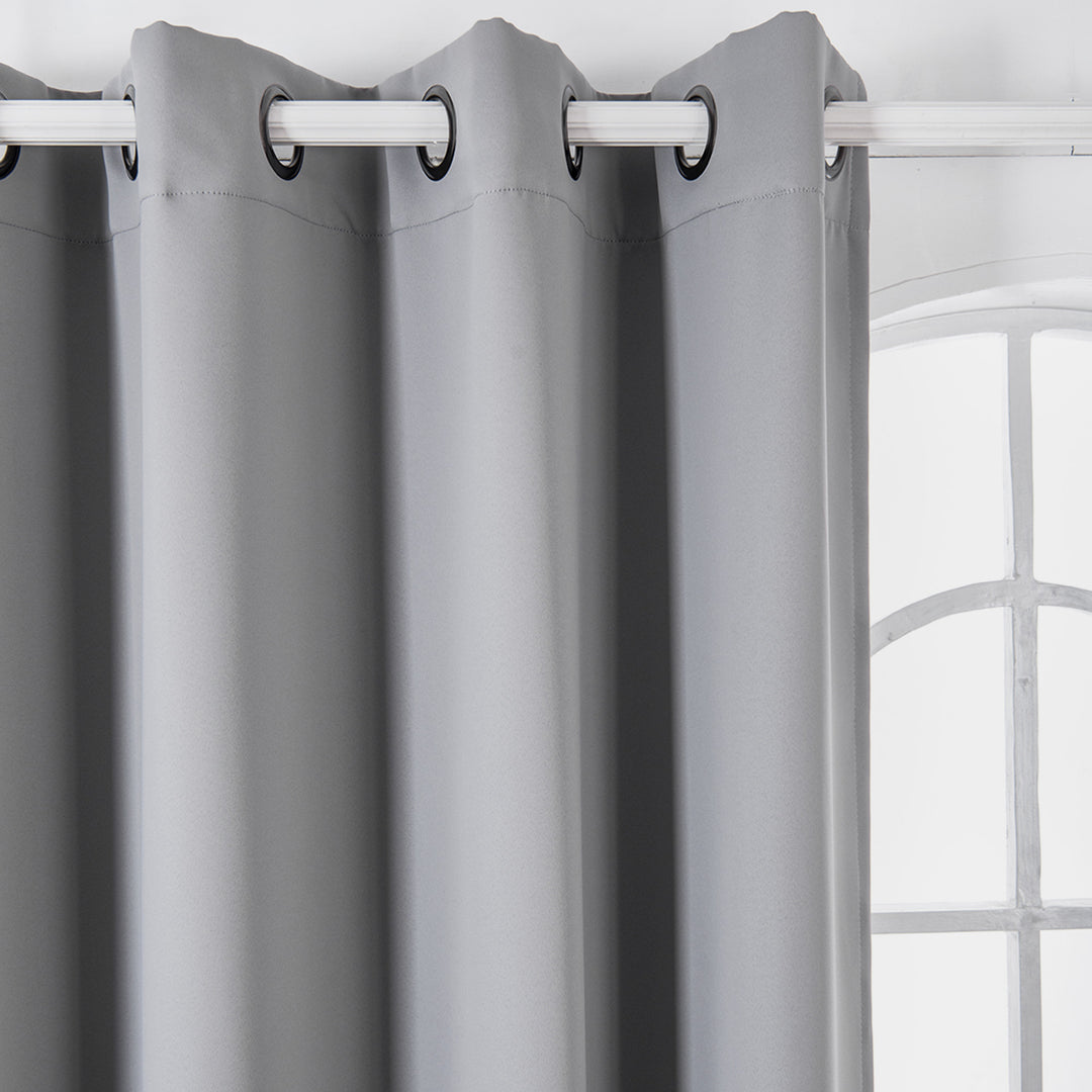 Teamson Home 63" Fossil Gray Lamia Premium Solid Insulated Thermal Blackout Window Curtain Panels with grommet tops on a metal rod in front of a window with white mullions.