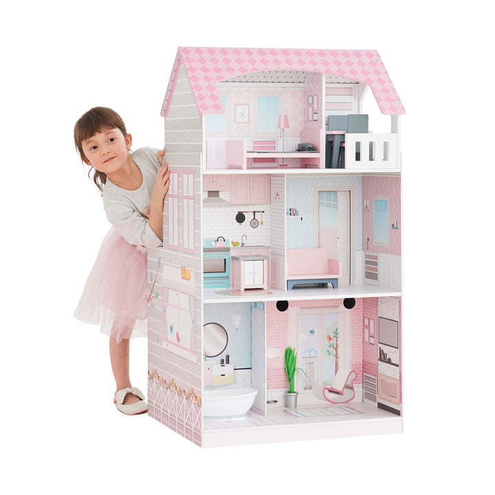 Young girl playing with a Teamson Kids Ariel 2-in-1 Double-Sided Play Kitchen with Accessories and Furnished Dollhouse for 12" Dolls, Pink and its accessories.